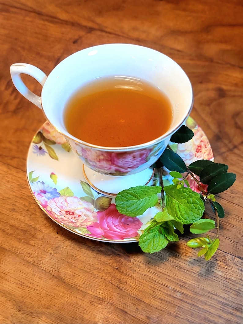 Native Yaupon Mint Tea in a floral teacup with fresh mint